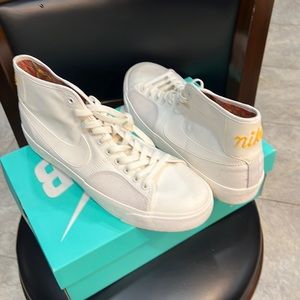 Men’s high top white canvas Nikes. New never worn.